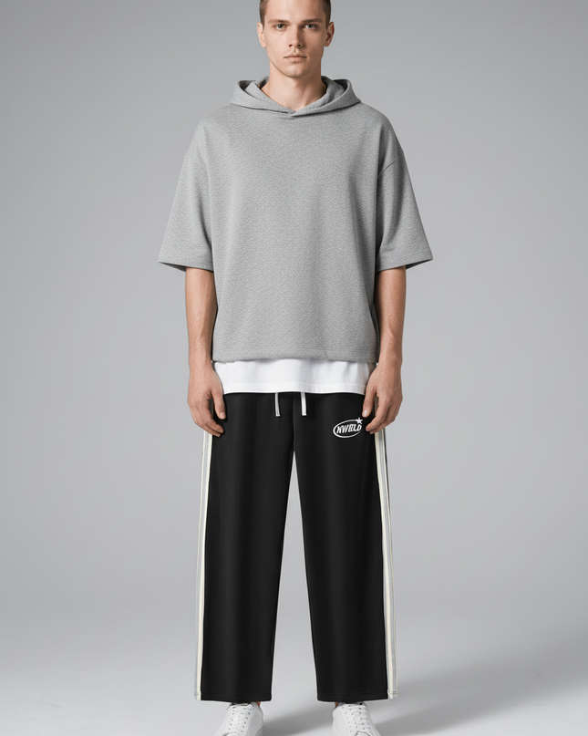 Full body view of the model wearing NWRLD 002 Side-Stripe Straight-Legs