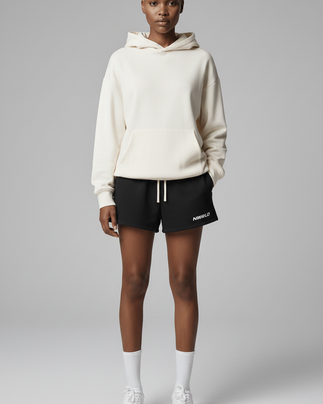 Full body view of the model wearing NWRLD 002 Fleece Drawstring Shorts