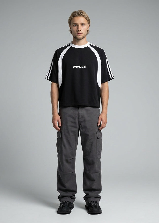 Full body view of the model wearing NWRLD 002 Contrast Panel Mesh T-shirt