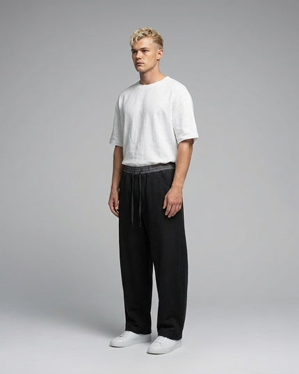 Model wearing Plaid Waistband Barrel Sweatpants