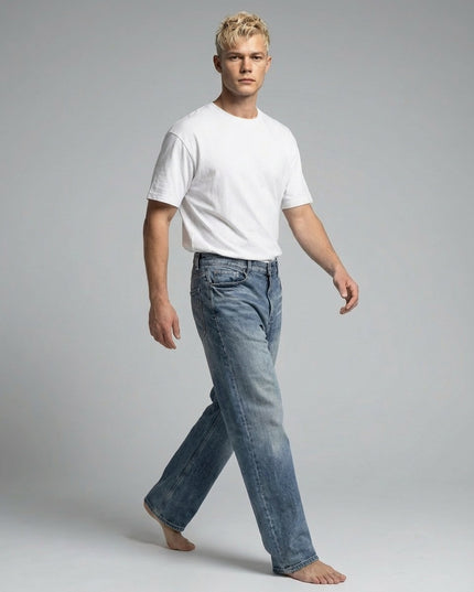 Model walking while wearing Sun Fade Heavyweight Denim Jeans