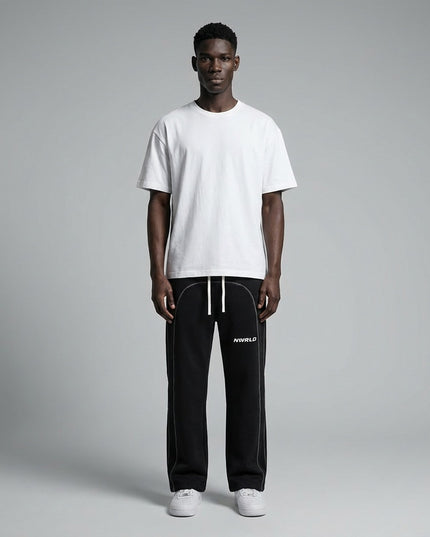 Full body view of the model wearing Contrast-Stitched Fleece Sweatpants