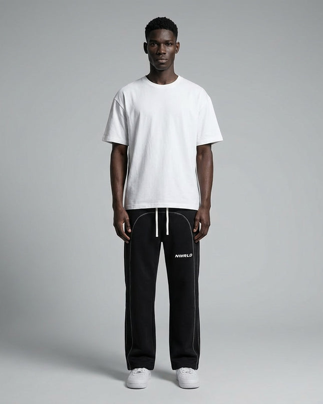 Full body view of the model wearing Contrast-Stitched Fleece Sweatpants