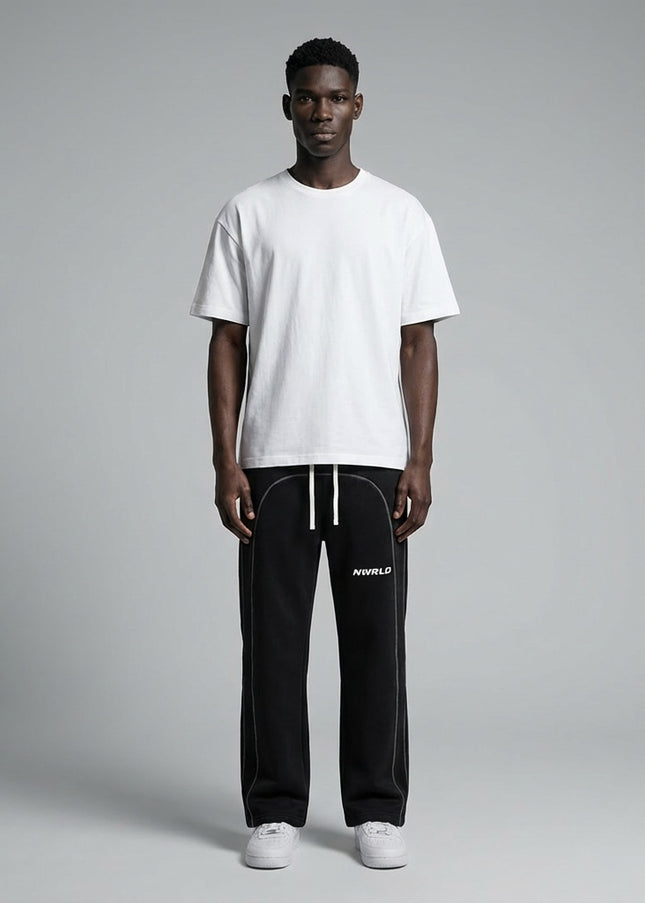 Full body view of the model wearing Contrast-Stitched Fleece Sweatpants