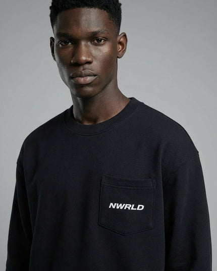 Close-up of the model wearing NWRLD 002 Heavyweight Crewneck Sweatshirt