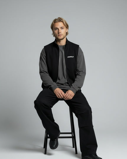 Model sitting while wearing Essential Heavyweight Vest