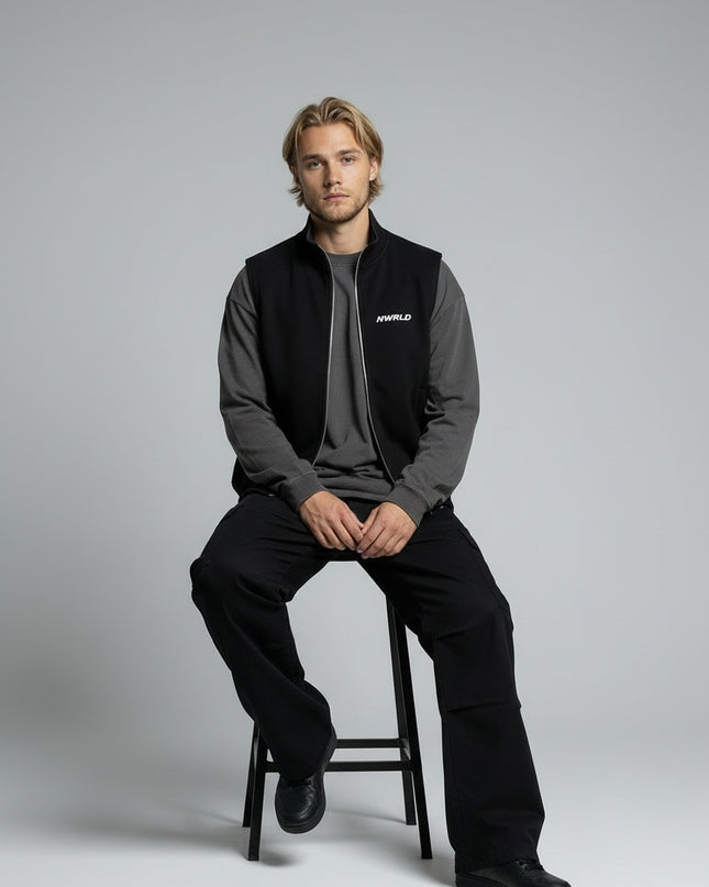 Model sitting while wearing Essential Heavyweight Vest