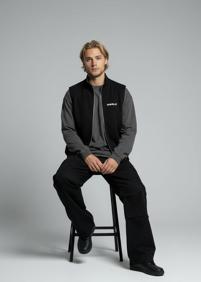 Model sitting while wearing Essential Heavyweight Vest