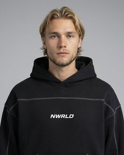Close-up of the model wearing Contrast-Stitched Boxy Fleece Hoodie