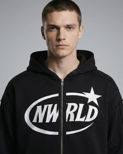 Close-up of the model wearing NWRLD 002 Contrast Tape Zip Hoodie