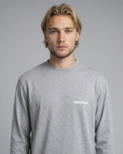 Close-up of the model wearing Essential Crewneck Long-Sleeve T-Shirt