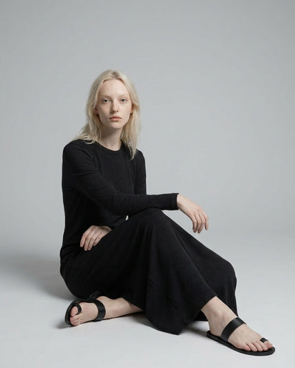 Model sitting while wearing Dyed Washed Slit Maxi Dress