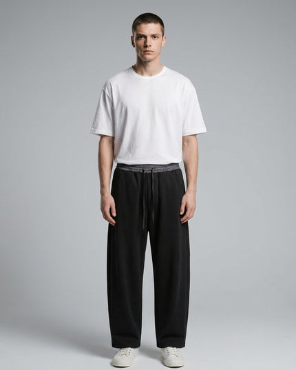 Full body view of the model wearing Plaid Waistband Barrel Sweatpants