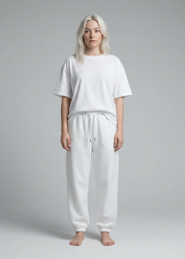 Full body view of the model wearing Essential Jogged Sweatpants