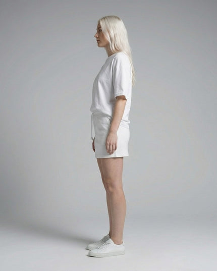 Side profile of the model wearing Essential Drawstring Skirt
