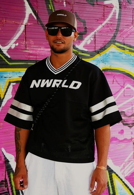 DJ Joe Jameson brings <em><strong>NWRLD</strong></em> heat to the white isle. From Hull to Ibiza, his sets hit different — powered by confidence, culture, and clean fits. The <em><strong>NWRLD</strong></em> jersey stays on rotation from the booth to the beach.