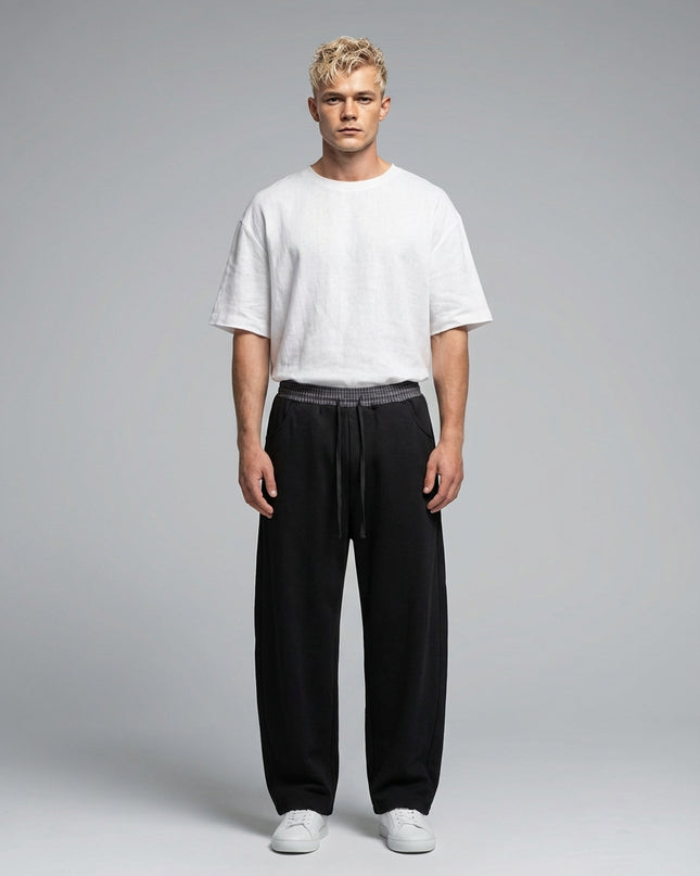 Full body view of the model wearing Plaid Waistband Barrel Sweatpants