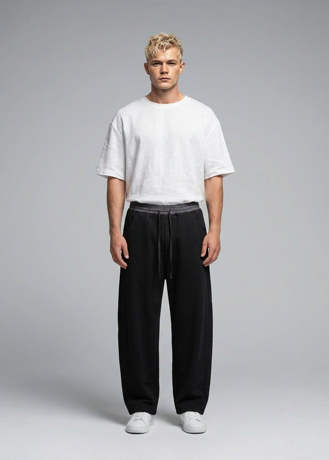 Full body view of the model wearing Plaid Waistband Barrel Sweatpants