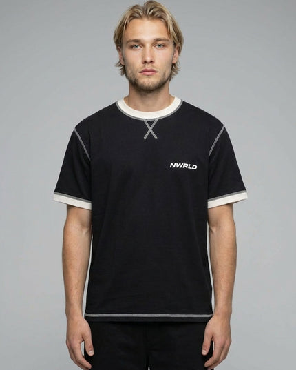 Close-up of the model wearing Contrast-Stitched Cotton T-Shirt