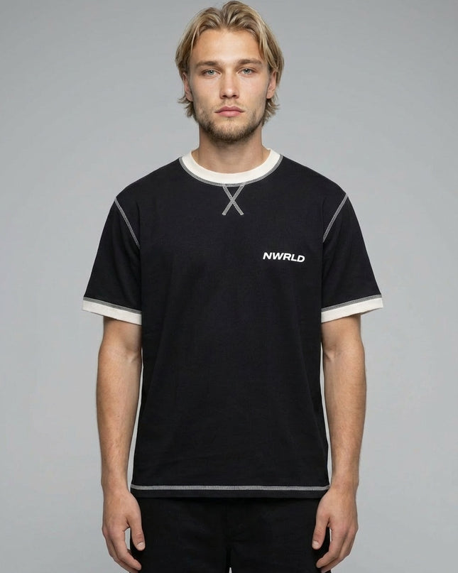Close-up of the model wearing Contrast-Stitched Cotton T-Shirt