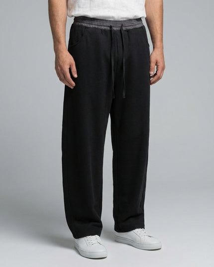 Close-up of the model's lower body wearing Plaid Waistband Barrel Sweatpants