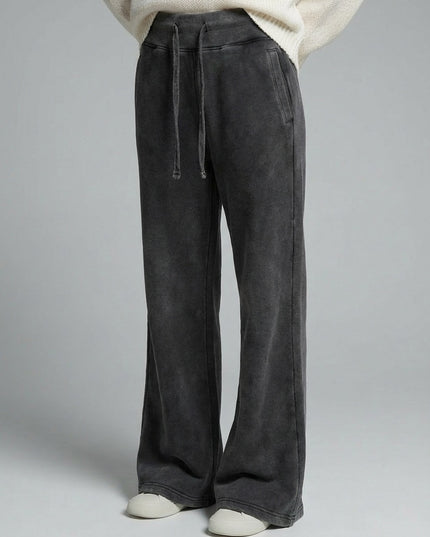 Close-up of the model's lower body wearing DROP 003 / Vintage Washed Flared Fleece Pants