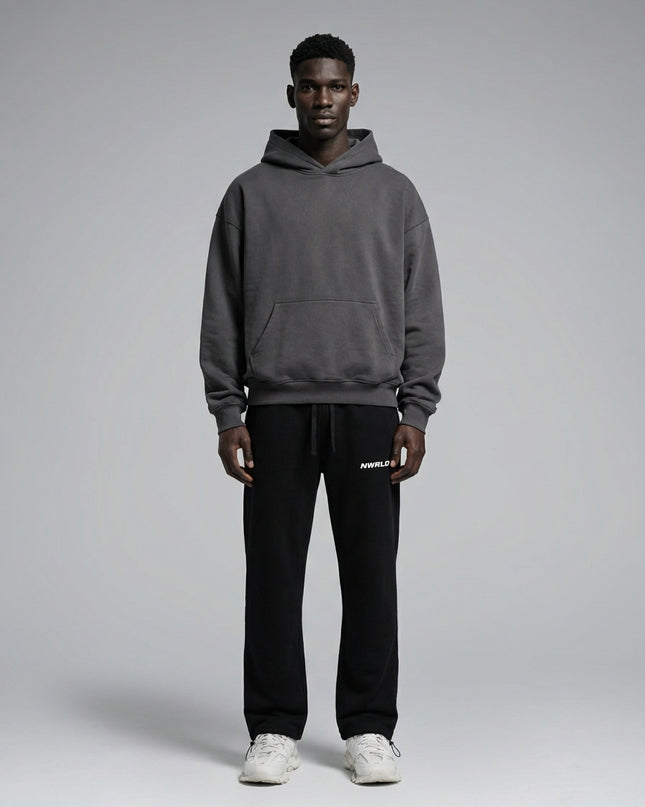 Full body view of the model wearing Essential Drawstring Straight-Leg Sweatpants