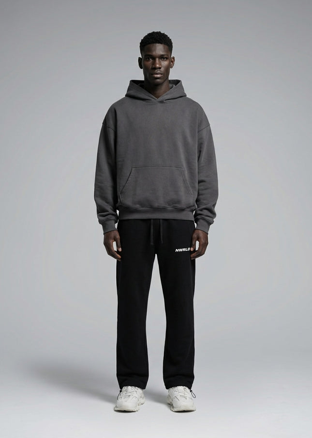 Full body view of the model wearing Essential Drawstring Straight-Leg Sweatpants