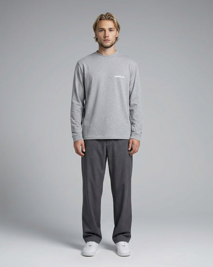 Full body view of the model wearing Essential Crewneck Long-Sleeve T-Shirt