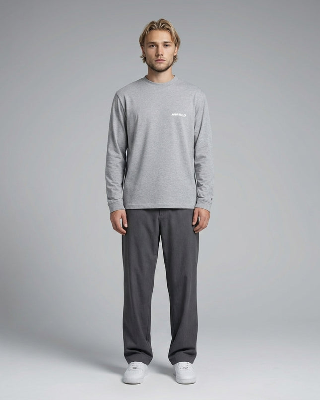 Full body view of the model wearing Essential Crewneck Long-Sleeve T-Shirt