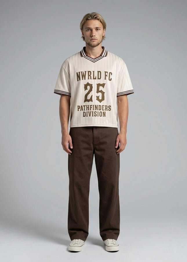 Full body view of the model wearing NWRLD 002 Pathfinders Football T-Shirt