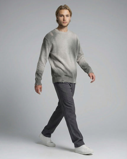 Model walking while wearing Sun Fade Distressed Ripped Crewneck sweater